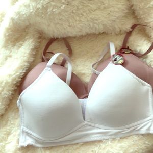 Bras 34B, white and rose Never worn.